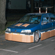 Illustration for article titled This Artist Turns Boring Rides Into Supercars At Night Using Cardboard